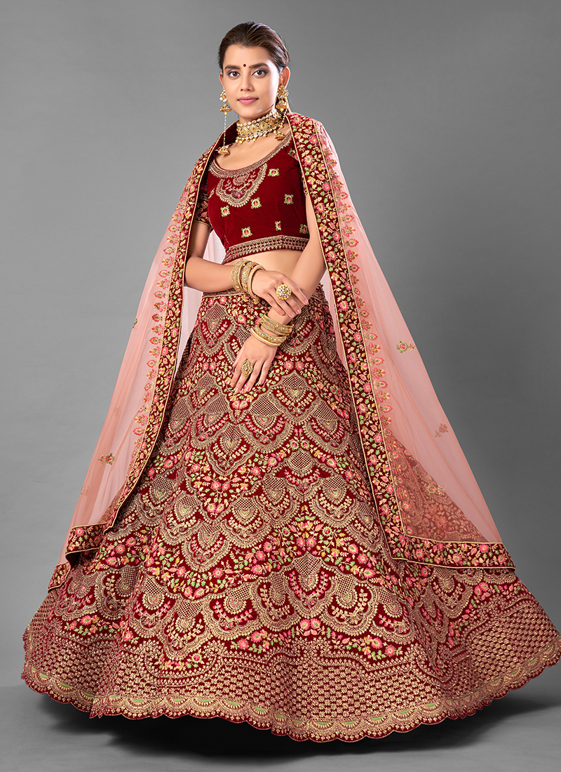 Bridal lehenga paired with brown color heavily embellished choli and two  net dupattas with heavy embroidered border in peach and maroon color  |lovelyweddingmall.com|