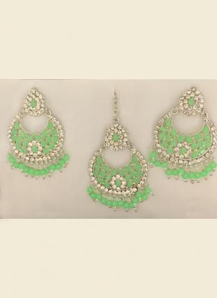 Pista Green Stone Studded Silver Plated Earrings With Maang Tikka